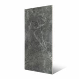 Atlanta Black porcelain slab Angled view showing deep charcoal grey marble surface with bold white veining and natural marble movement for UAE interior design