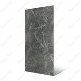 Atlanta Black porcelain slab Angled view showing deep charcoal grey marble surface with bold white veining and natural marble movement for UAE interior design
