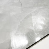 Close-up of Onyx Lural glossy porcelain tile showing mirror-polished translucent onyx surface with delicate dark vein detail and 9mm thickness