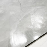 Close-up of Onyx Lural glossy porcelain tile showing mirror-polished translucent onyx surface with delicate dark vein detail and 9mm thickness