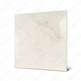 Cecelia Gold large format porcelain tile angled view highlighting polished Calacatta Oro marble finish and rectified edges