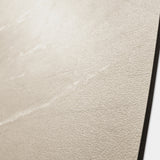 Close-up of Element Cotano Dust porcelain slab showing refined ivory surface with fine wispy veining and warm sand undertones
