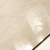 Close-up of Marfil Pearl glossy porcelain tile showing mirror-polished warm beige marble surface with fine vein detail and 9mm thickness