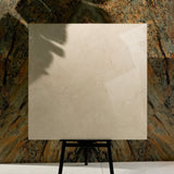 Marfil Pearl 120x120cm glossy porcelain tile flat view showing warm beige Crema Marfil marble surface with delicate veining