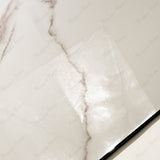 Close-up of Grisial Pink glossy porcelain tile showing mirror-polished cream marble surface with detailed copper vein clusters and 9mm thickness
