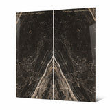 Close-up of Elite Black BM porcelain slab showing mirror-polished surface with detailed flowing white veins and warm copper-toned accents