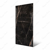 Black Daytona large format porcelain slab angled view highlighting polished Nero Portoro marble finish, dramatic veining, and rectified edges