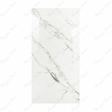 Garfagnana BM porcelain slab displayed on easel against luxury backdrop showing pure white marble surface with delicate grey diagonal veining for UAE interior design