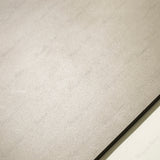 Portland Bianco 120x120cm matt porcelain tile with subtle stone textures. Durable, elegant, and perfect for modern floors and walls.