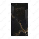 Black Onyx porcelain slab displayed on easel against luxury backdrop showing dramatic translucent onyx with golden amber movement for UAE interior design