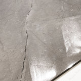 Close-up of Burberry Grey glossy porcelain tile showing mirror-polished marble surface with delicate black vein detail and 9mm thickness