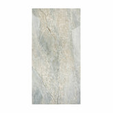 Aurora Aqua Onyx porcelain slab displayed on easel against luxury backdrop showing soft aqua quartzite with beige veining for UAE interior design