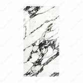 Impact Statuario porcelain slab displayed on easel against luxury backdrop showing crisp white marble surface with elegant grey veining for UAE interior design