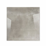 Portland Grey glossy porcelain tile 120x120cm displayed on easel against luxury marble backdrop for UAE interior design