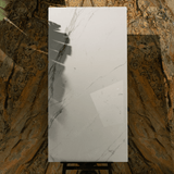 CRSM 117 tiles (80x160cm, 9mm) feature a polished surface with a sleek and modern design. Suitable for both floors and walls, these tiles are perfect for adding a touch of elegance to any indoor space.