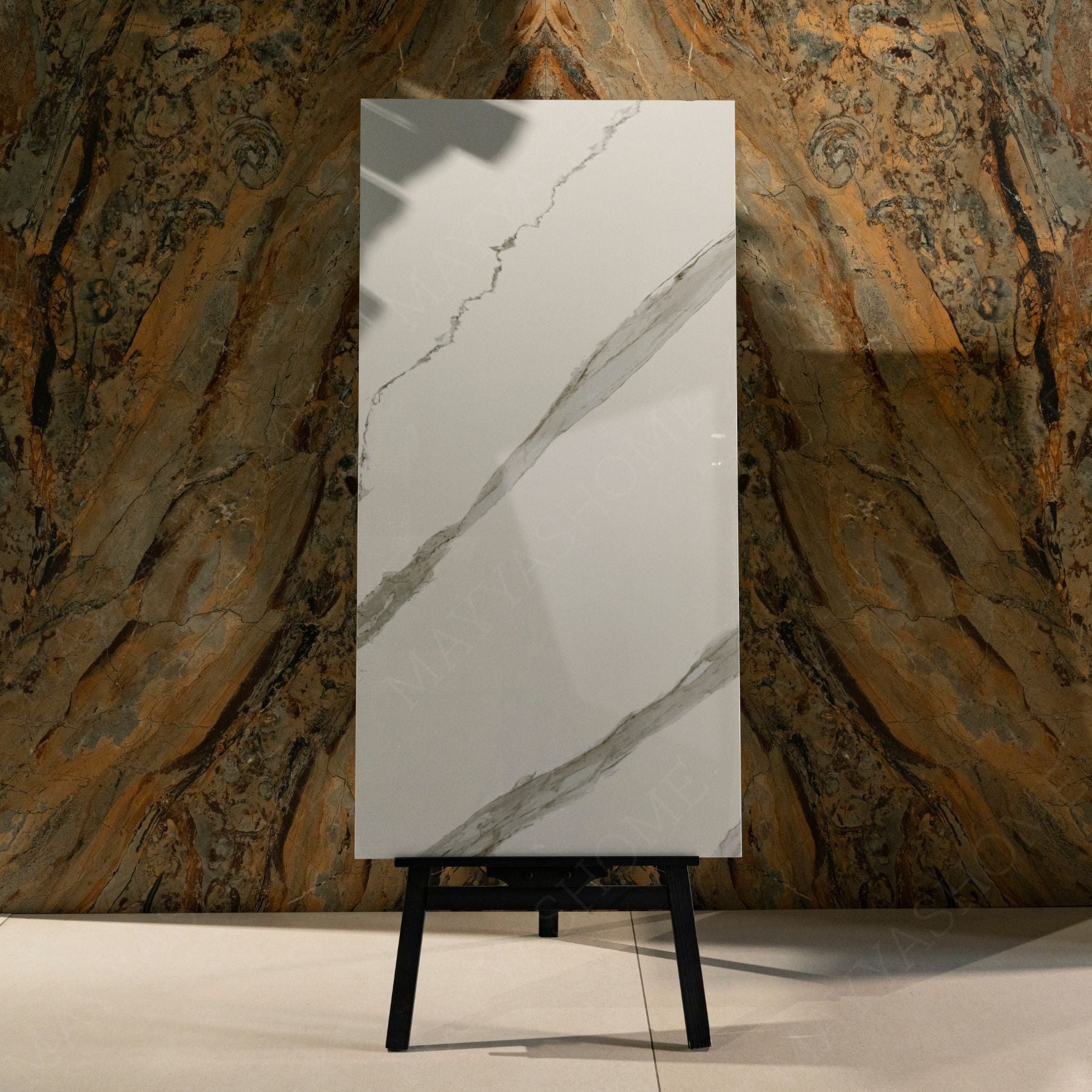 Calcatta Noir glossy marble effect porcelain tile 60x120cm with 9mm thickness features white base, bold black veining and polished finish.