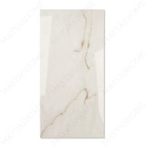 Calcutta Bianco Oro glossy marble porcelain tile 60x120cm with 9mm thickness features white base, gold and grey veining with polished finish.