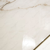 Calcutta Bianco Oro glossy marble porcelain tile 60x120cm with 9mm thickness features white base, gold and grey veining with polished finish.