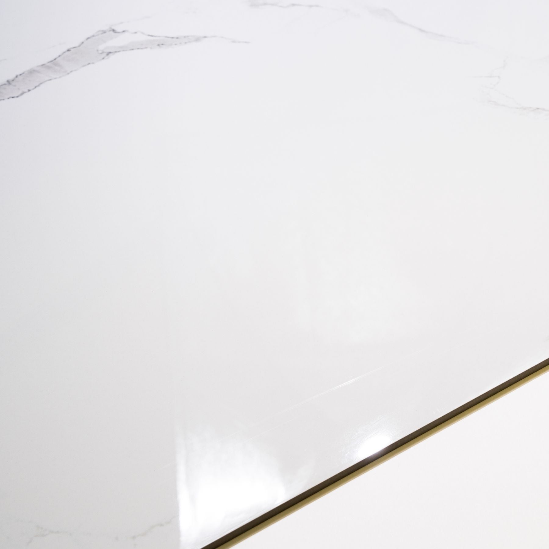 Eterna White glossy marble effect porcelain tile 60x120cm with 9mm thickness features bright white base, soft grey veins and polished finish.