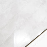 Fur Ice glossy marble effect porcelain tile 60x120cm with 9mm thickness features icy white base, soft grey texture and polished finish.