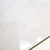 Sparkle Bianco glossy marble effect porcelain tile 60x120cm with 9mm thickness features bright white base, subtle grey veining and polished finish.
