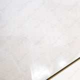 Sparkle Bianco glossy marble effect porcelain tile 60x120cm with 9mm thickness features bright white base, subtle grey veining and polished finish.