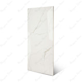 Statuario Ocean glossy marble effect porcelain tile 60x120cm with 9mm thickness features white base, soft grey veining, subtle ocean tones and polished finish.