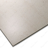 White Dune porcelain tile in 60x120cm size with soft sand effect, subtle white tones and durable 9mm thickness for walls and floors.