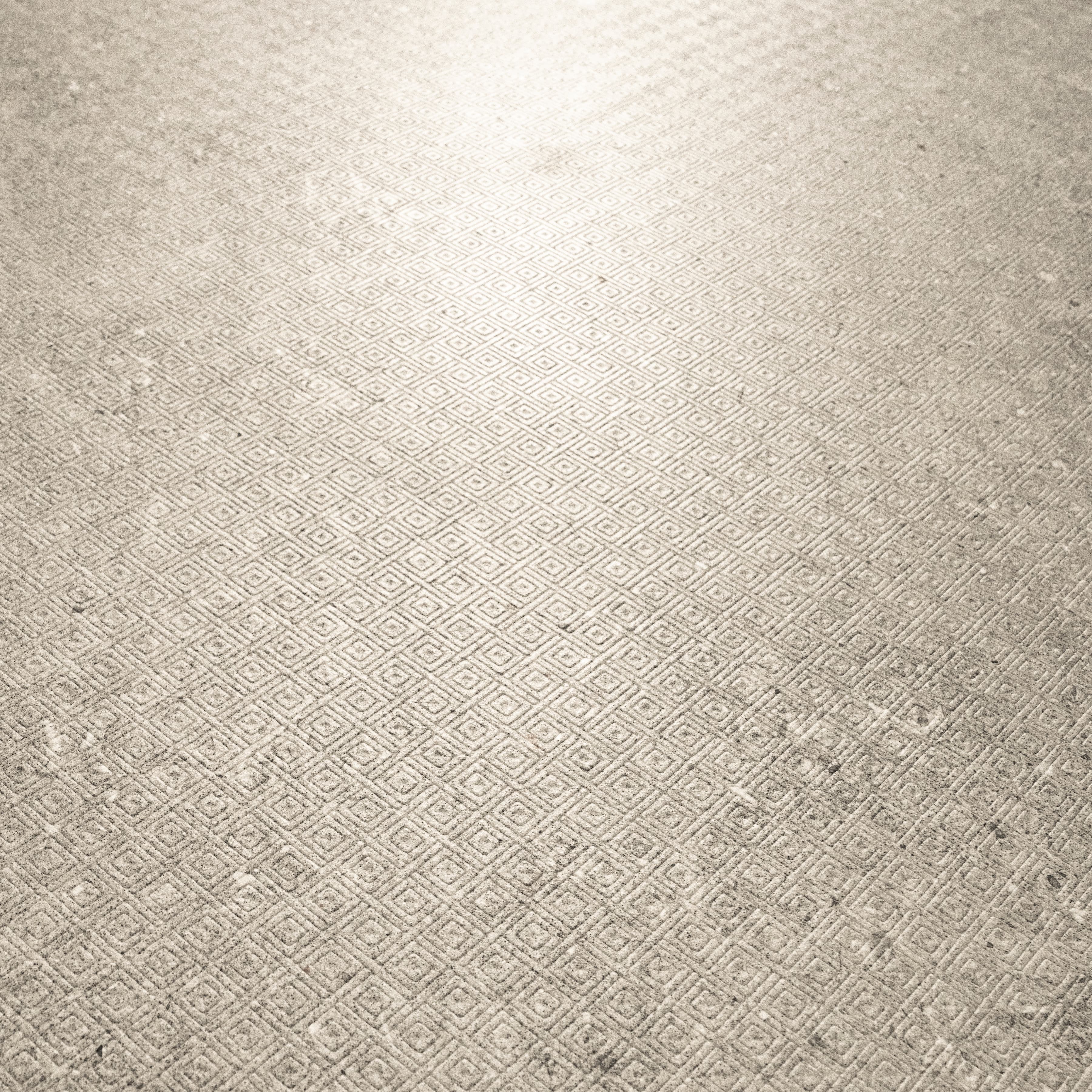 Close-up of Element Arsenica Grey porcelain slab showing refined grey surface with delicate mineral speckle and cool neutral undertones