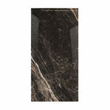 Elite Black BM porcelain slab displayed on easel against luxury backdrop showing dramatic black marble with white and amber veining for UAE interior design