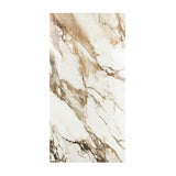 Macchia Vechia BM porcelain slab displayed on easel against luxury backdrop showing white marble with dramatic caramel brown veining for UAE interior design