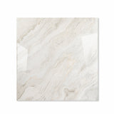 Antaliya White glossy porcelain tile 120x120cm displayed on easel against luxury marble backdrop for UAE interior design