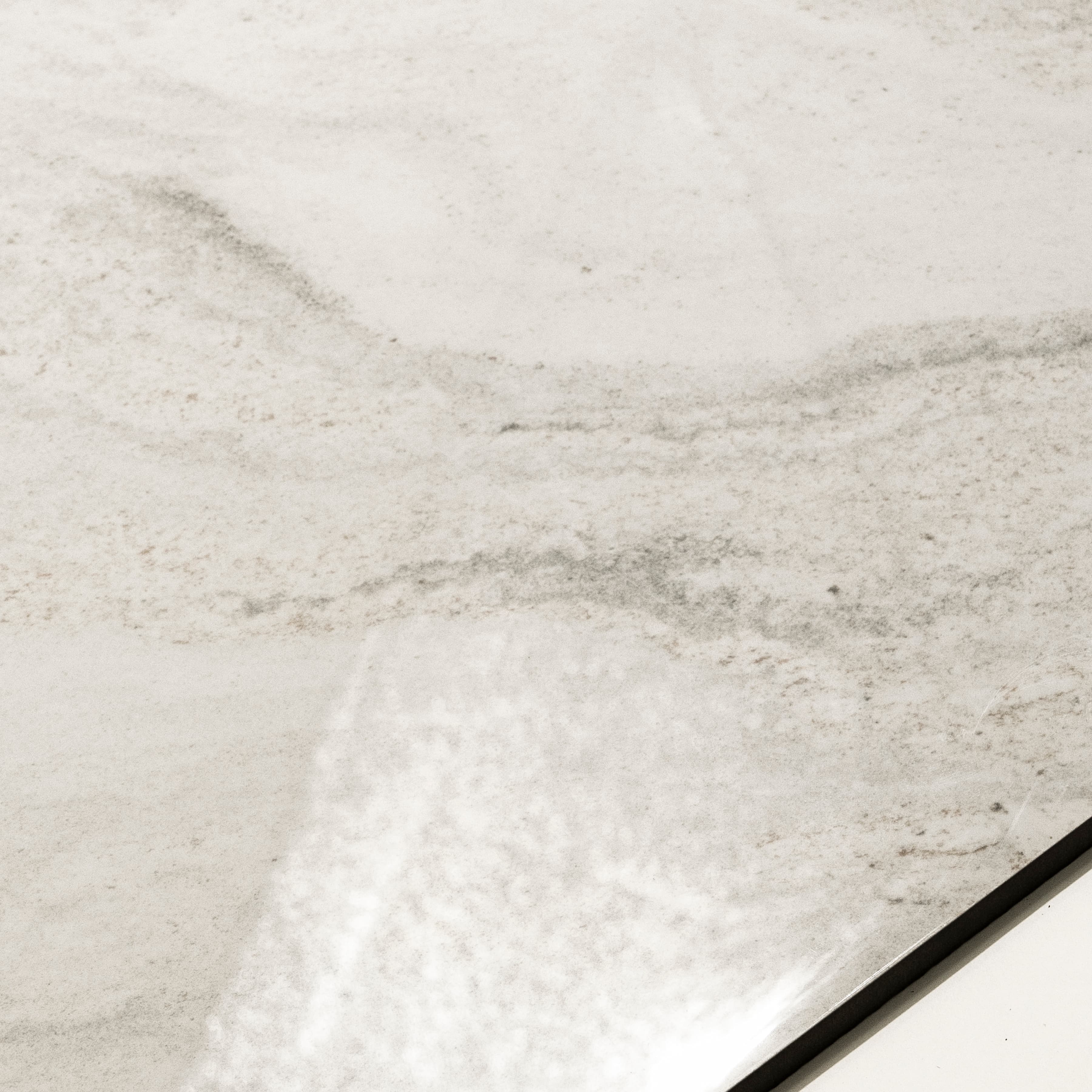 Close-up of Antaliya White glossy porcelain tile showing mirror-polished marble surface with detailed veining and 9mm thickness