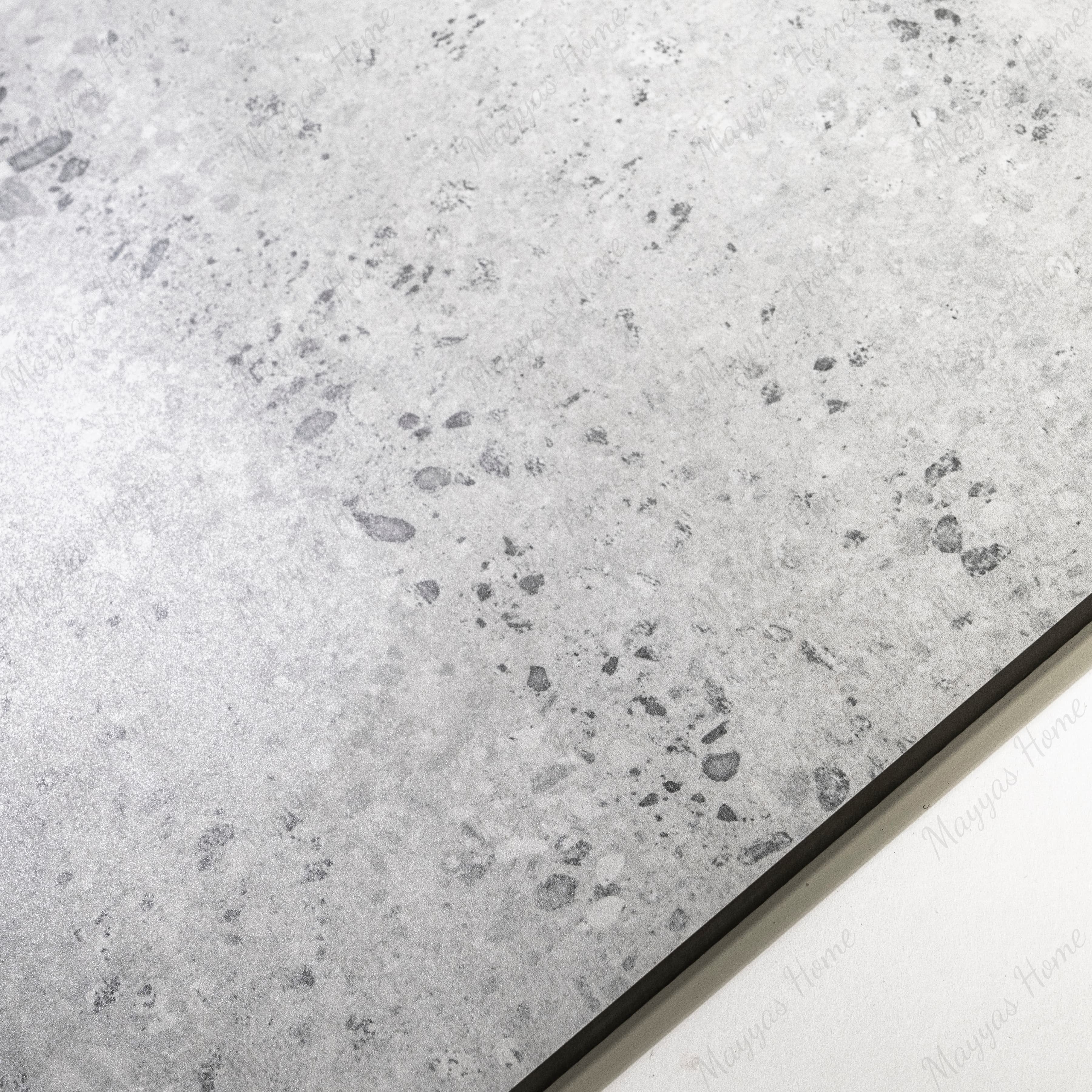 Close-up of Stonex Grey matte porcelain tile showing detailed pebble aggregate texture, natural stone effect, and 9mm thickness