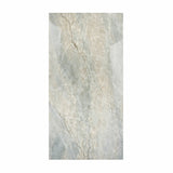 Aurora Aqua Onyx porcelain slab displayed on easel against luxury backdrop showing soft aqua quartzite with beige veining for UAE interior design