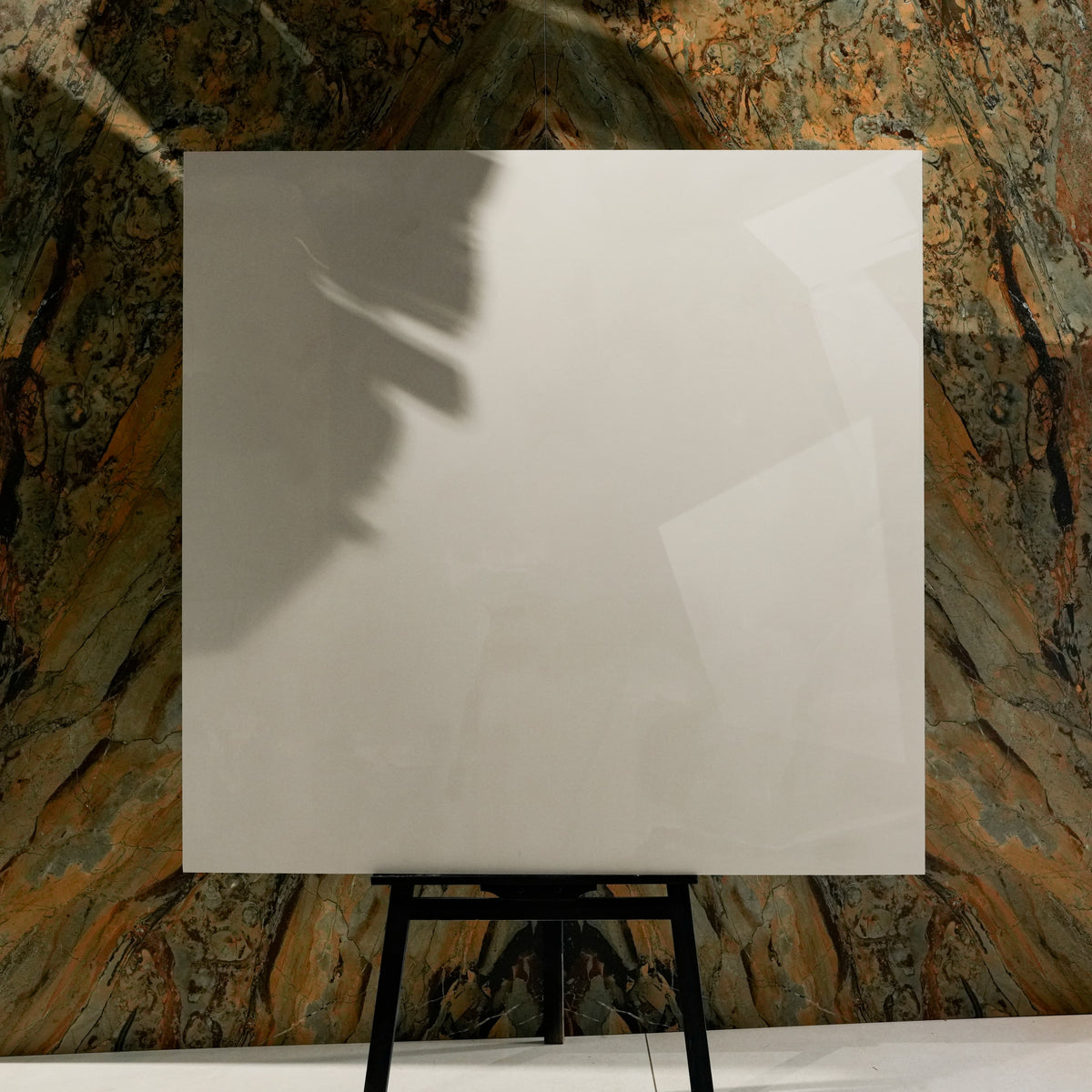 Onyx Helio 120x120cm glossy porcelain tile flat view showing translucent ivory onyx surface with soft cloudy movement
