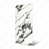 Impact Statuario large format porcelain slab angled view highlighting polished white marble finish, dramatic linear veining, and rectified edges