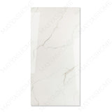 Statuario Ocean glossy marble effect porcelain tile 60x120cm with 9mm thickness features white base, soft grey veining, subtle ocean tones and polished finish.